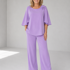 Lavender two-piece top and wide-leg pants set with ruffle shoulder detail