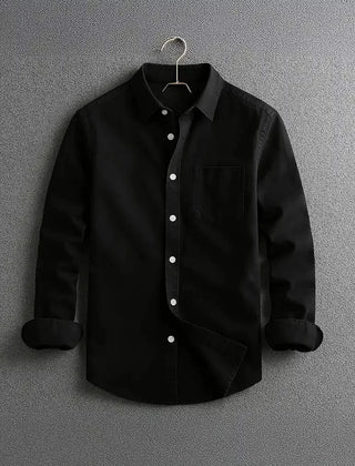 Black long-sleeve button-up shirt with chest pocket and diagonal front panel.