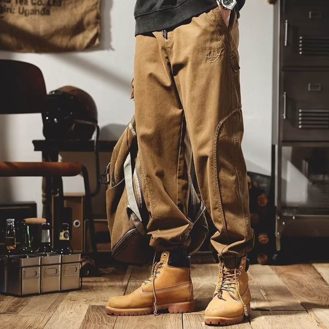 Brown cargo pants with front pockets and tapered legs, ankle-length view