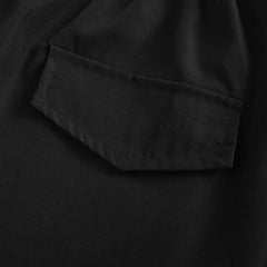 Ashford utility shorts, close-up of black side pocket with flap and reinforced stitching