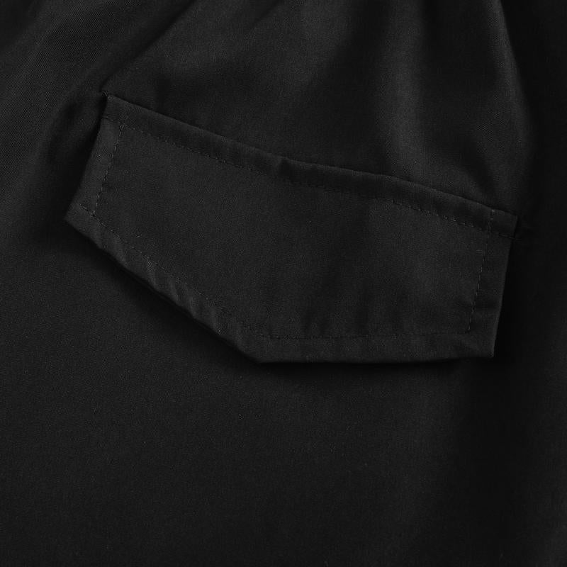 Ashford utility shorts, close-up of black side pocket with flap and reinforced stitching