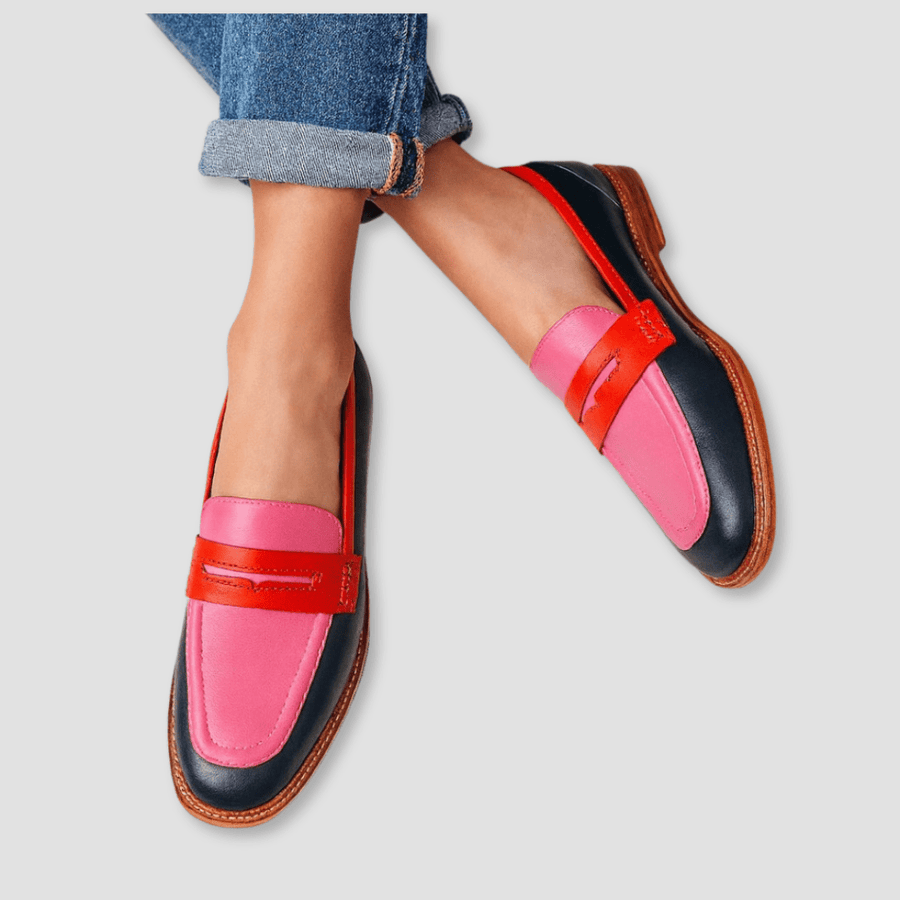 Pink and navy loafers with red strap accents and tan rubber sole