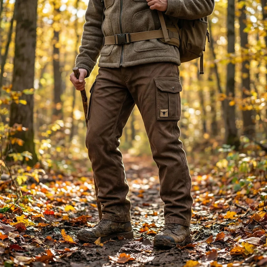 Dark brown insulated utility pants with cargo pocket and belt, outdoors
