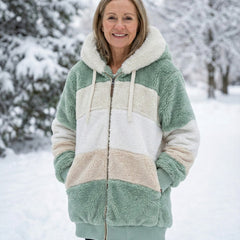Plush colorblock jacket in sage green, cream, and light tan with zip front and hood