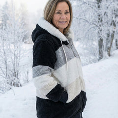 Plush colorblock zip-up jacket in black, gray, and cream with hood and drawstrings