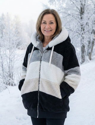 Plush colorblock jacket in black, gray, and cream with zip front and hood