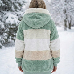 Back view of plush colorblock jacket in sage green and cream with hood