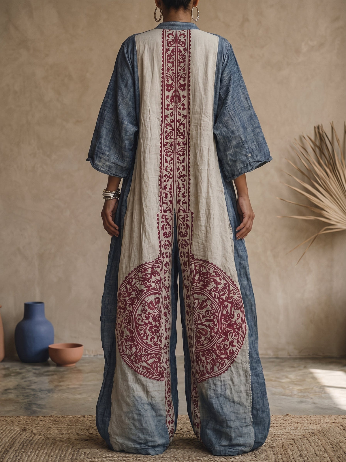 Printed two-piece set back view: indigo top with vertical cream panel and burgundy print