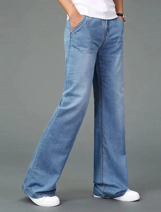 Medium light blue flare boot cut jeans with side seam stitching and wide bell leg