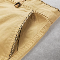 Khaki cotton shorts showing front seam and patterned inner facing detail