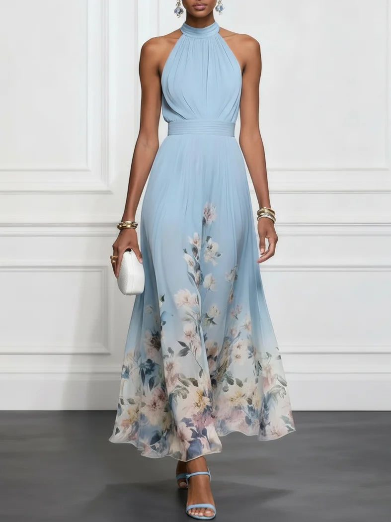 Light blue halter maxi dress with floral print, sleeveless gathered bodice and flowy skirt.