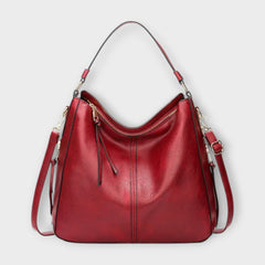 Large hobo bag in red leather-look with front center seam and zipped top pocket