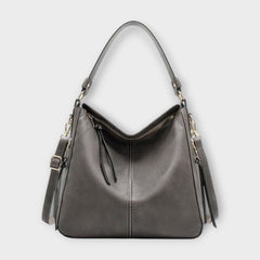 Large hobo bag in gray leather-look with front center seam and hanging side tassels