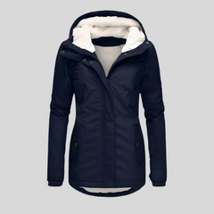 Navy waterproof hooded jacket with faux-fur lining, zip front, and buttoned utility pockets.