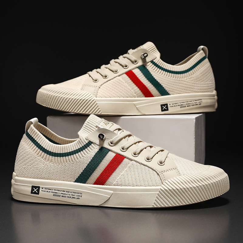 Sandstone knit sneakers with multicolor side stripe, lace-up eyelets, on display
