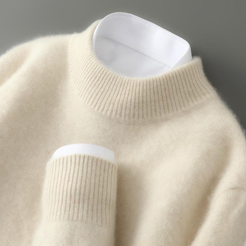 Cream soft knit mock neck jumper with ribbed cuffs and long sleeves.