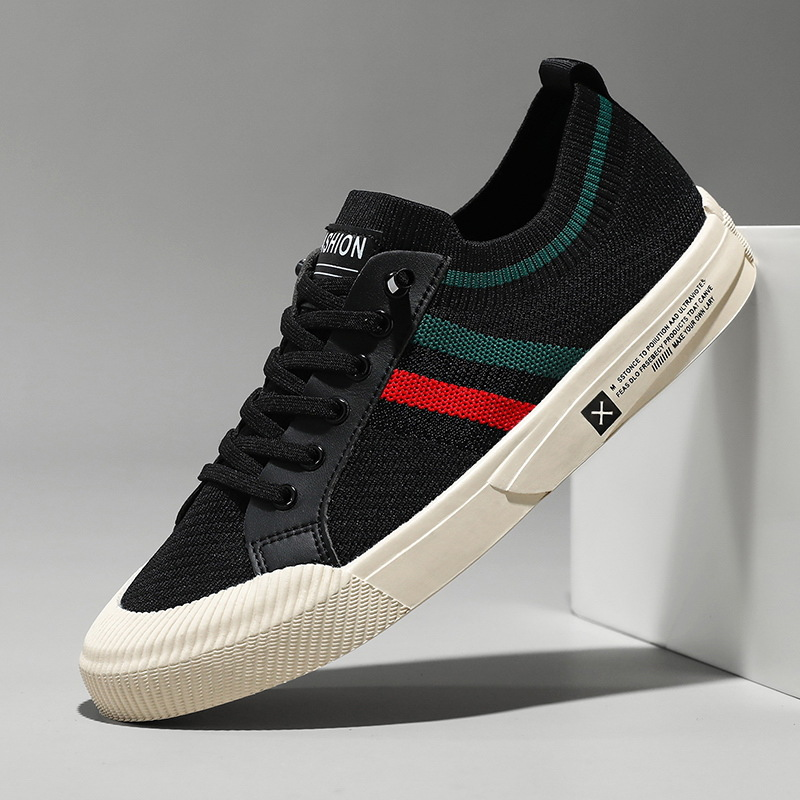 Black knit sneakers, angled view with multicolor side stripe, lace-up and rubber sole