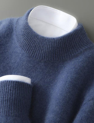 Blue soft knit mock neck jumper with ribbed collar and long sleeves.