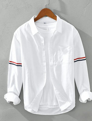 White linen shirt with button front, chest pocket, and striped sleeve cuffs