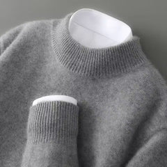 Grey soft knit mock neck jumper with ribbed cuffs and long sleeves.