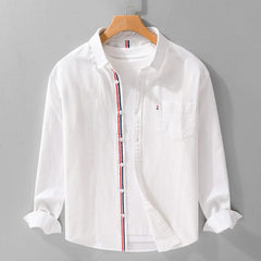White linen button-up shirt with contrast vertical trim and chest pocket