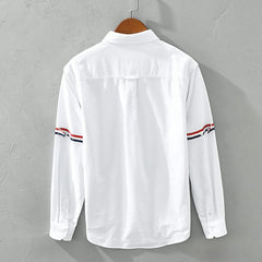 White linen shirt back view with button placket and striped sleeve cuffs