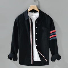 Black cotton button-up shirt with chest pocket and red striped sleeve panel
