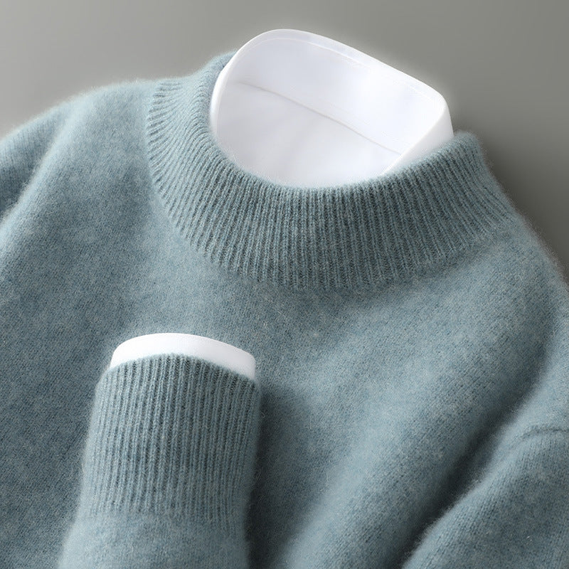 Light blue soft knit mock neck jumper with ribbed collar and sleeve cuffs.