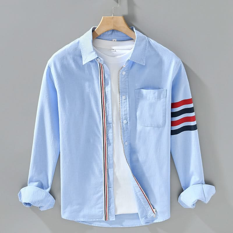 Light blue cotton button-up shirt with chest pocket and striped sleeve