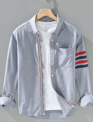 Grey cotton button-up shirt with chest pocket and striped sleeve cuff