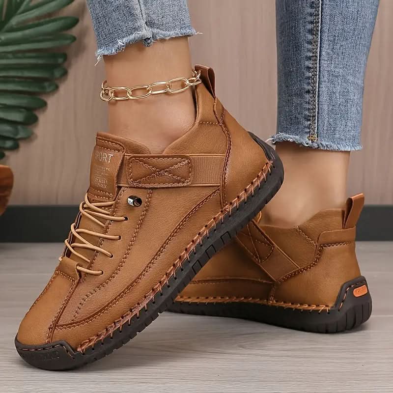 Brown orthopedic high-top sneakers with lace-up closure and side ankle strap