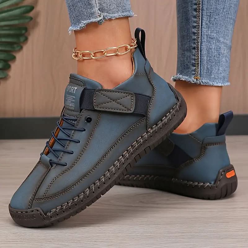 Dark blue orthopedic high-top sneakers with lace-up front and hook-and-loop ankle tab