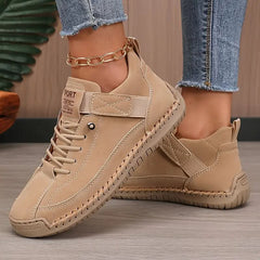 Beige orthopedic high-top sneakers with lace-up front and ankle side panel
