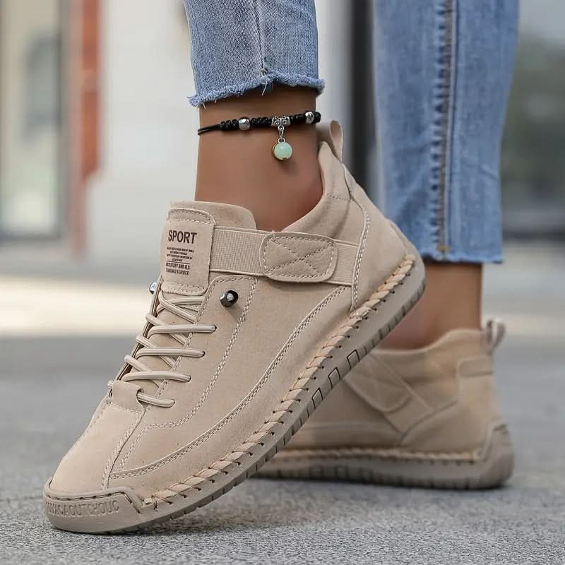 Light beige orthopedic high-top sneakers with lace-up closure and ankle support strap