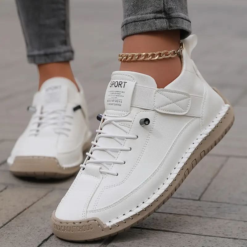 White orthopedic high-top sneakers with lace-up closure and quilted ankle strap