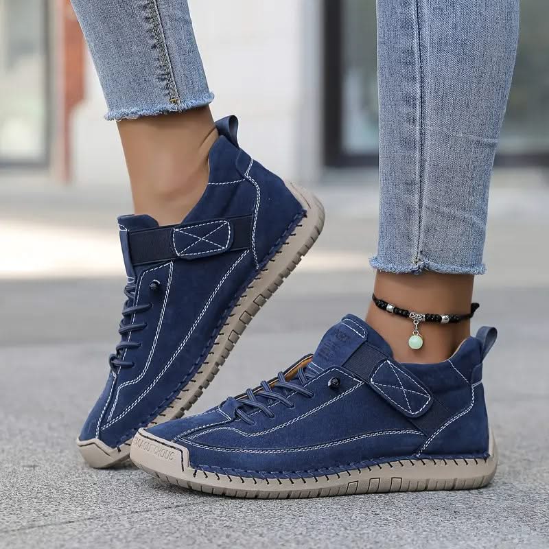 Navy orthopedic high-top sneakers with lace-up closure and padded tongue