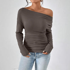 Dark gray long sleeve asymmetrical shoulder top with draped ruched center.