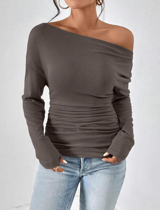 Dark gray long sleeve asymmetrical shoulder top with draped ruched center.