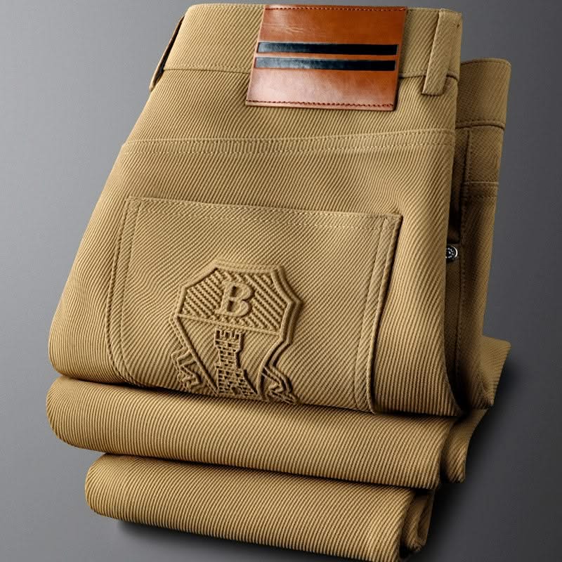 Khaki premium pants close-up of back pockets with embossed logo patch