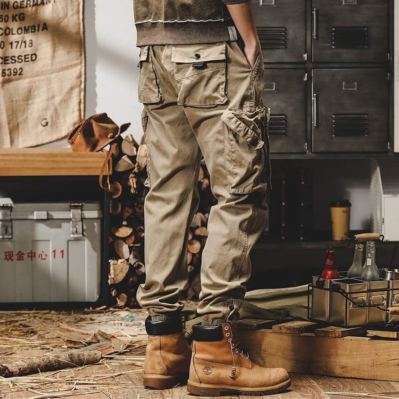 Khaki utility trousers with thigh cargo pockets and cuffed leg openings