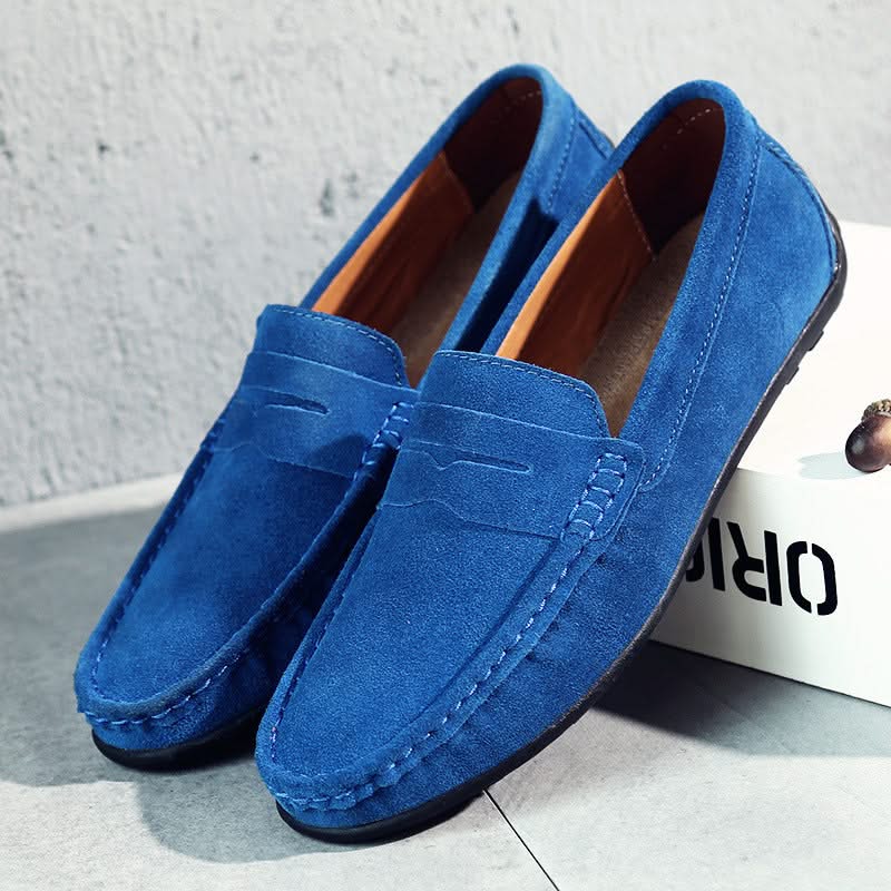 Suede loafers in aqua blue with moc stitching, strap detail, and tan lining