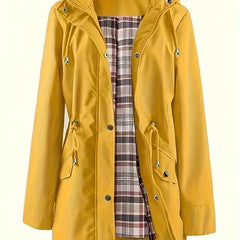 Women’s 3-in-1 jacket in mustard yellow, hooded outer layer with plaid inner lining.