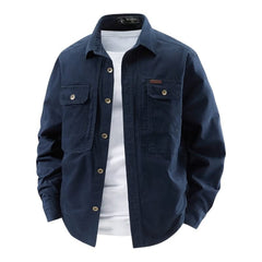 Navy utility shirt with button front, two chest flap pockets, long sleeves.