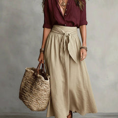 Two-piece set: maroon blouse and beige midi skirt with tie waist