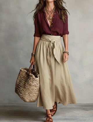 Two-piece set: maroon blouse and beige midi skirt with tie waist