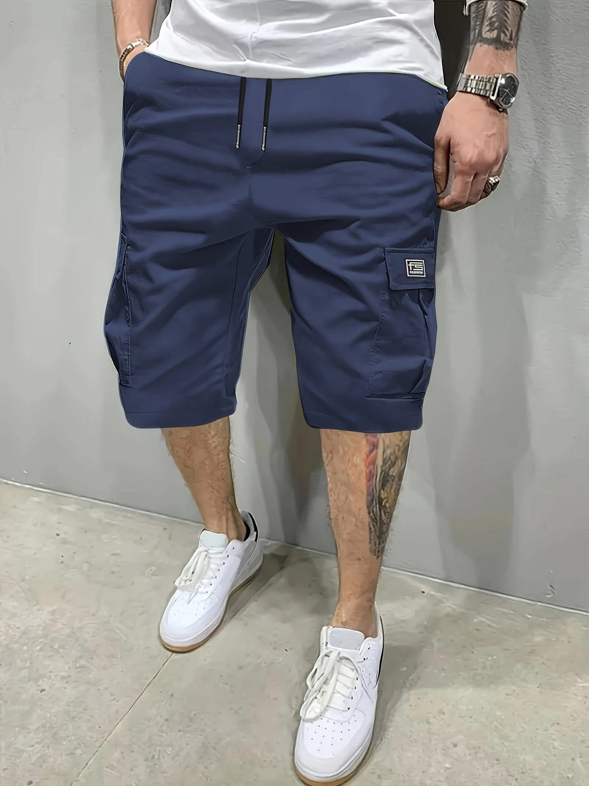Navy utility shorts with drawstring waist and side cargo pockets