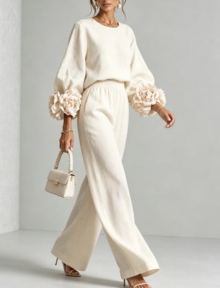 White two-piece set: long-sleeve blouse and wide-leg pants with floral puff cuff sleeves