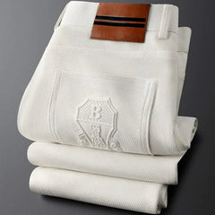 BASTILLE™ premium pants front view, off-white pinstripe with leather logo patch
