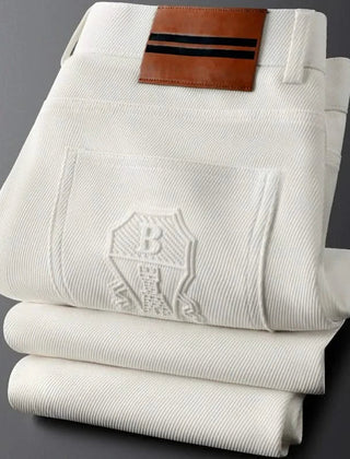 BASTILLE™ premium pants front view, off-white pinstripe with leather logo patch