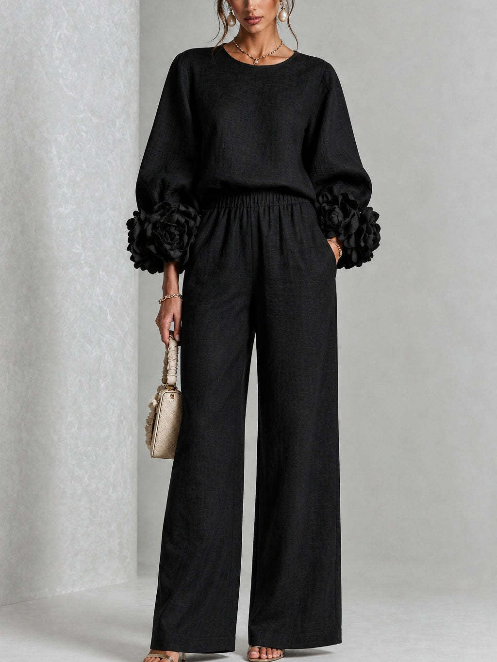 Black two-piece set: long-sleeve blouse and wide-leg pants with floral puff cuff sleeves